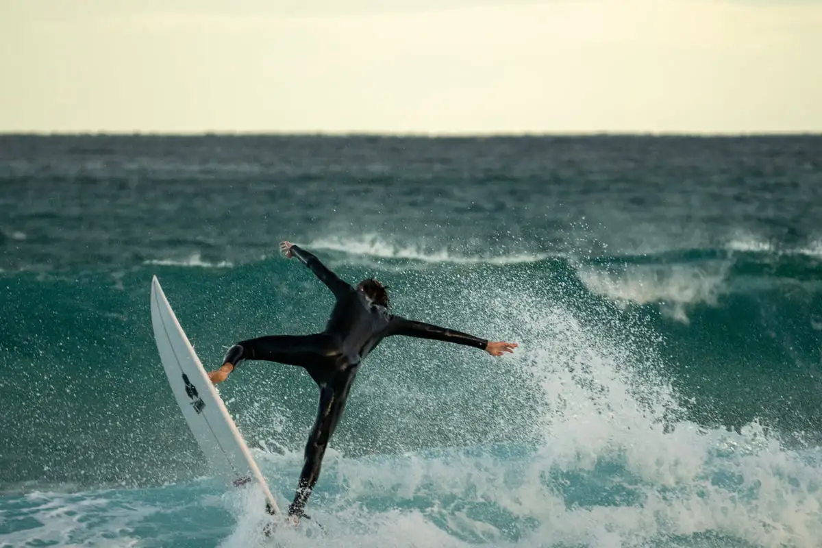 surfer catching a wave on saturday